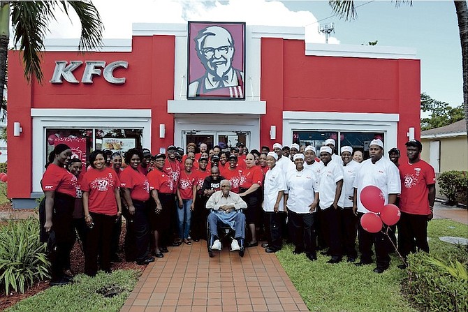 Bahamian music legend Ronnie Butler joins KFC staff as they celebrate 50 years in The Bahamas. 