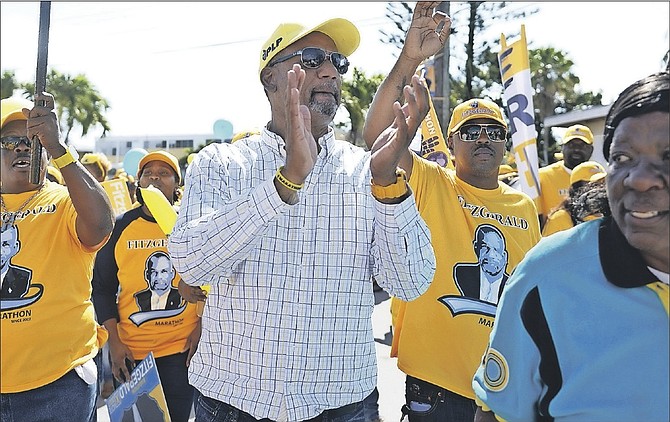 The Progressive Liberal Party candidate for Marathon, Jerome Fitzgerald, on his way to being nominated at CI Gibson High School, accompanied by his supporters. Photo: Shawn Hanna/Tribune Staff