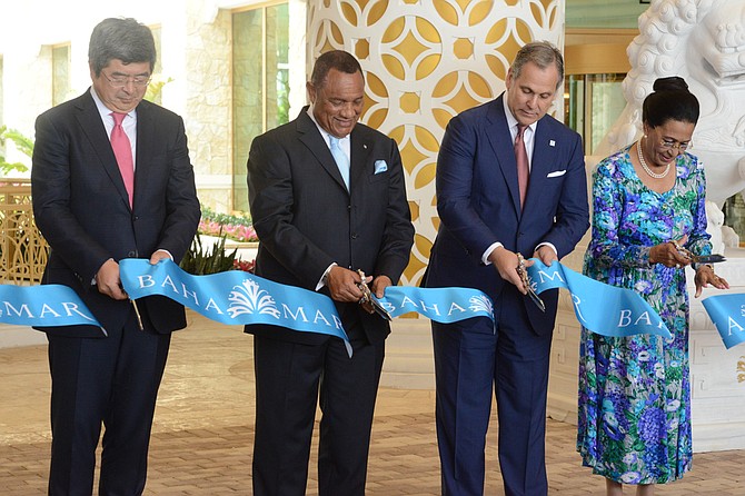 Governor General Dame Marguerite Pindling participates in the official ribbon cutting ceremony to declare the opening of Baha Mar phase one on Friday with Prime Minister Perry Christie, China Construction America President Ning Yuan and Baha Mar President Graeme Davis. Photo: Peter Ramsay/BIS

 