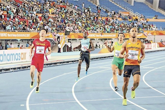 ADRIAN GRIFFITH (centre) is caught in the closing metres by Trinidad & Tobago and Germany in the 4x100 metre relay on Saturday.  
                                                                                                                                                                                                       Photo: Terrel W Carey/Tribune Staff