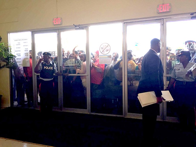 Voters queue outside Kendal Isaacs gymnasium.