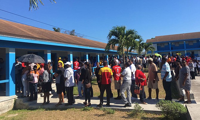 Voters in Fort Charlotte line up at St Francis Joseph Primary School on election day.