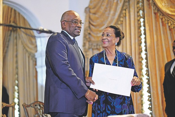 Prime Minister Dr Hubert Minnis with Governor General Dame Marguerite Pindling at his swearing in ceremony on Thursday.