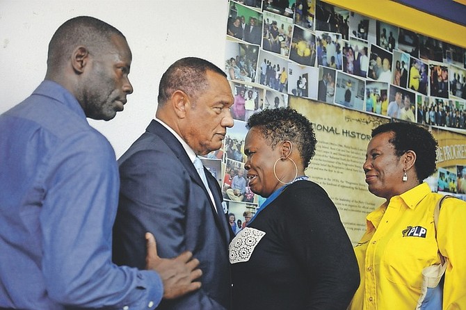 Former Prime Minister Perry Christie with party supporters at Monday night's meeting.