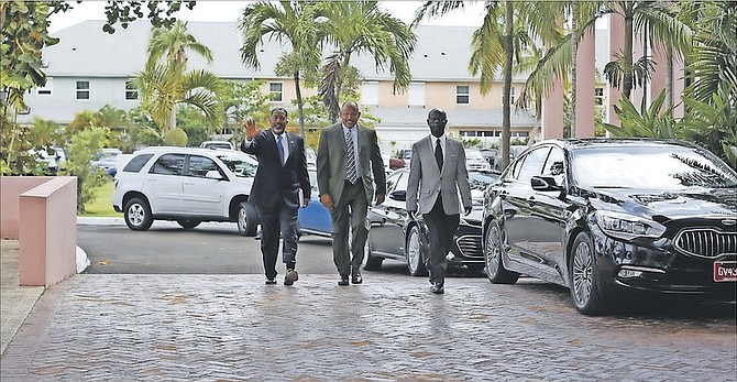 Dr Duane Sands, centre, arriving for the first Cabinet meeting under the new government at the Office of the Prime Minister on Tuesday. Photo: Terrel W. Carey/Tribune Staff