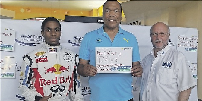 Wellington Miller, President of the Bahamas Olympic Committee, holds his personal road safety message “You drink, I drive” as he joins the campaign to save five million lives worldwide by the year 2020. He is pictured with David McLaughlin (right), Bahamas Development Director for the FIA, the World Governing Body of motor sport and UN programme partner and safety campaign ambassador Curt Thompson, an EduKarting programme graduate who is now a commercial pilot. 

Photos: Diane Phillips & Associates   
