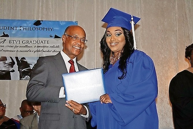 New Minister of Education Jeffrey Lloyd presents a graduand with her diploma cover during BTVI’s 2017 commencement exercise at the Melia Nassau Beach Resort. Photos: Shantique Longley/BTVI
