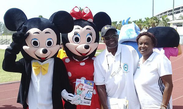FRANK ‘PANCHO’ RAHMING and his sister, Stephanie, share a special moment with Disney characters. 