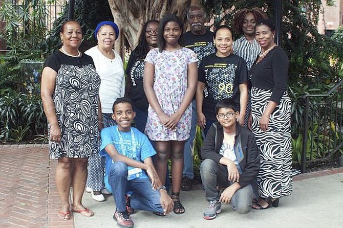 Bahamas National Spelling Bee Champion Jee’von Pratt (kneeling left) at the Gaylord National Resort and Convention Center with members of the Bahamian contingent in Washington for the 2017 Scripps National Spelling Bee. Kneeling right is Sarthak Saxens, and standing from left to right are Nicola McKay, Eula Gaitor, Nickara Pratt, India Bowleg, Austin Pratt, Neneth Pratt, Francina Beneby and Patrinella Rolle. Photo: Elisabeth Ann Brown

 