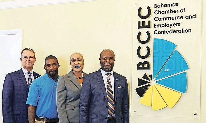 L-R: Mike Maura, chairman BCCEC; Omar Cartwright, Sign Man; Patricia Cleare, Sign Man; Edison Sumner, chief executive, BCCEC.