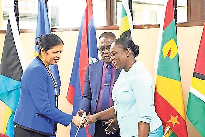 Dr Manorma Soeknandan (left), Deputy Secretary-General of CARICOM, meeting with PANCAP Director Nicolette Henry as Dereck Springer looks on during the launch of the new PANCAP website.
