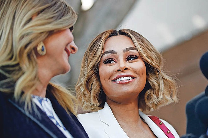 Blac Chyna, right, and her attorney Lisa Bloom smile at a news conference outside a courthouse on Monday, July 10, 2017, in Los Angeles. A court commissioner has granted Chyna a temporary restraining order against her former fiancee, reality television star Rob Kardashian. Photo: Jae C. Hong/AP

