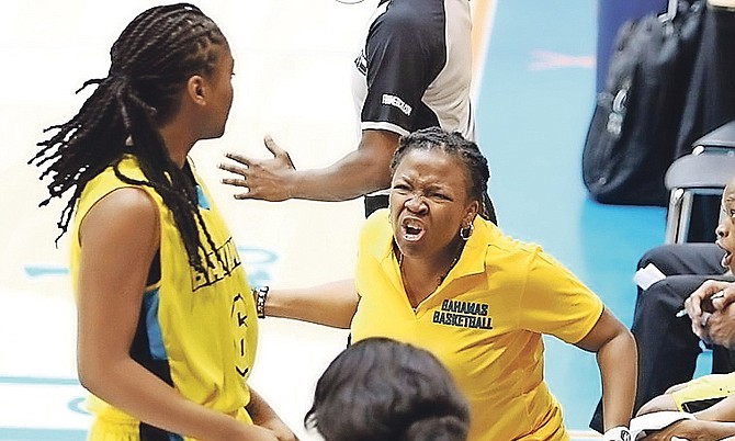 Coach Yolett McPhee-McCuin reacts on the sidelines as the Bahamas falls 64-48 to Jamaica. 