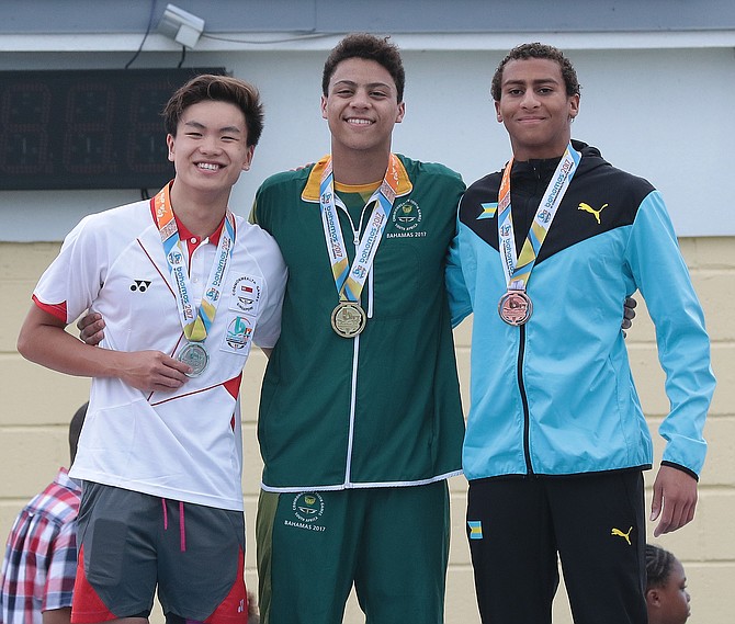 

Izaak Bastian (right) receives his second medal at the Commonwealth Youth Games. He is pictured with gold medalist Michael Houlie and silver medalist Samuel Khoo. Photo - Derek Smith/BIS