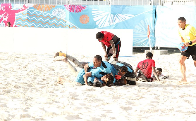 The Bahamas men's beach soccer team celebrate their bronze medal. Photo - Clarence Rolle CYG