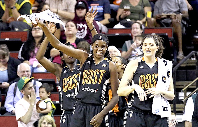 Eastern Conference's Jonquel Jones, left, of the Connecticut Sun, and Stefanie Dolson, of the Chicago Sky, cheer from the bench in the first half of the WNBA All-Star basketball game against the Western Conference. (AP)