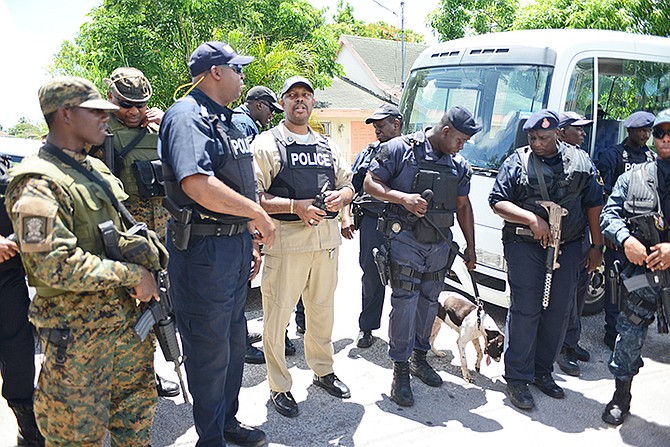 The Royal Bahamas Police Force commenced a major crime suppression operation in several communities on Wednesday. Officers are pictured in the Bain and Grants Town community. Photo: Shawn Hanna/Tribune Staff


