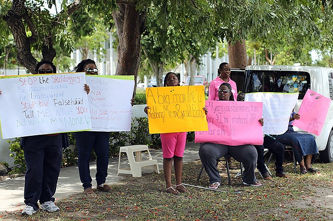 Former employees of BAF and policy holders held a peaceful protest outside of the establishment on Bailou Hill Road. Photo: Terrel W. Carey/Tribune Staff
