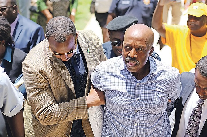 Former Minister of Labour and National Insurance Shane Gibson outside court yesterday. He was later granted bail. Family members and PLP supporters gathered outside court for his appearance. Photo: Terrel W. Carey/Tribune Staff
