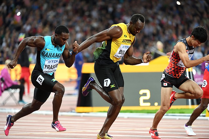 Warren Fraser (left) in action against Usain Bolt (centre). Photo: Kermit Taylor/Bahamas Athletics
