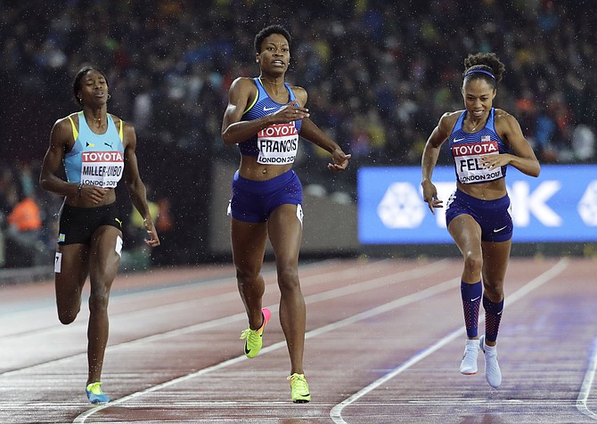 United States' Phyllis Francis, centre, crosses the line to win the gold medal in the Women's 400m final ahead of United States' Allyson Felix, right, and Shaunae Miller-Uibo during the World Athletics Championships in London Wednesday, Aug. 9, 2017. (AP Photo/David J. Phillip)