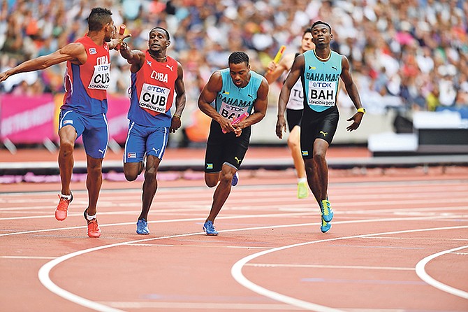 Michael Mathieu taking on the baton in the second leg of the men's 4x400 in the World Championships in London. Photo: Kermit Taylor/Bahamas Athletics