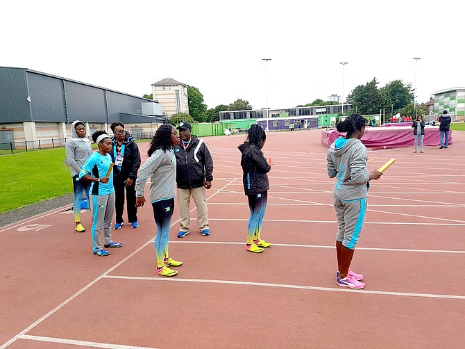 Head coach Dianne Woodside-Johnson and relay coordinator Rupert Gardiner overlook the women's 4 x 100m relay practice before the World Championships.