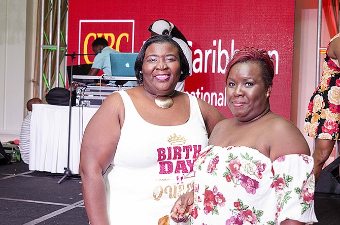 SISTERS Jenell Nairn, left, and Janice Minnis, who lost their sister, Vernique Nairn, to cancer in May, show their support at the CIBC FirstCaribbean Soca Party for the Cure.