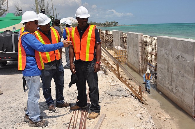 Deputy Prime Minister and Minister of Finance K Peter Turnquest, second from left, and Central Grand Bahama MP Iram Lewis toured the construction site of a sea wall in Smith’s Point, Grand Bahama on Friday. Photo: Vandyke Hepburn/BIS

 