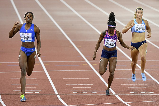 Shaunae Miller-Uibo wins the women's 200m followed by second placed Elaine Thompson of Jamaica, centre, and fourth placed Dafne Schippers of Netherlands, right, during the Weltklasse IAAF Diamond League international athletics meeting in the Letzigrund stadium in Zurich, Switzerland. (Walter Bieri/Keystone via AP)
