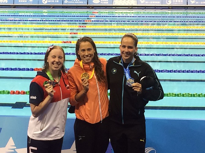 Joanna Evans (right) with one of her medals.