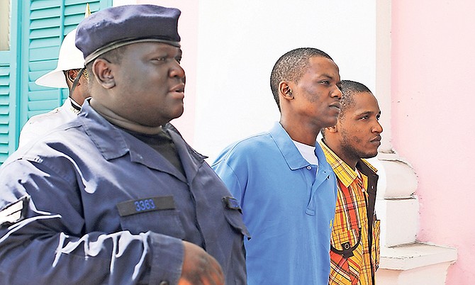 Tiano D’Haiti (centre), of Thompson Lane, is accused of murder and attempted armed robbery, while Kevin Andrews, of Montell Heights, is accused of murder, attempted armed robbery and burglary and in connection with the October 28, 2014, incident. Photo: Terrel W. Carey/Tribune Staff