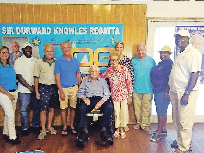 Lori Lowe, Danny Strachan, Jimmy Lowe, Randy Knowles, Holly Knowles, Charlotte Knowles, Robert Dunkley, Cindy Gay and Stafford Armbrister surround Sir Durward Knowles.

