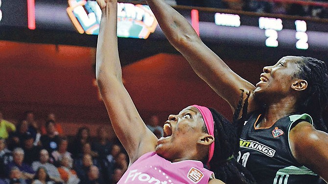Connecticut Sun’s Jonquel Jones shoots in front of New York Liberty’s Tina Charles during a WNBA game in Uncasville, Connecticut. Jones finished the season with 403 rebounds to surpass the mark of 398 set by Charles in 2010. Charles was one of the first to take to Twitter and congratulate the second year Bahamian forward.

(John Shishmanian/The Norwich Bulletin via AP)

 