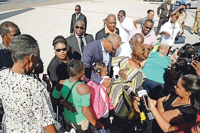 Prime Minister Dr Hubert Minnis greeting evacuees from MICAL and Ragged Island as they arrive in Nassau.