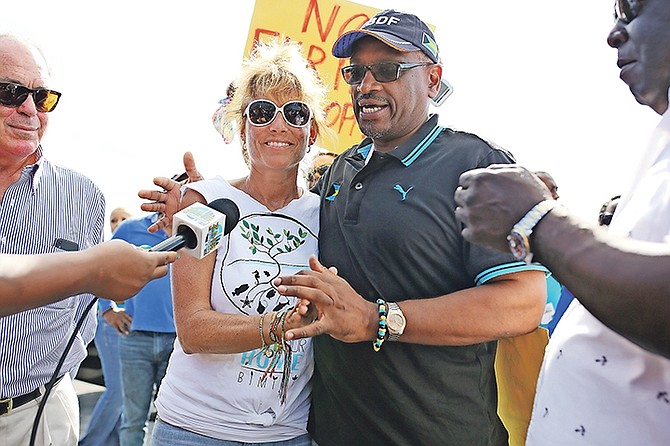 Jenny Cook, spokesperson for Save Our Home, with Prime Minister Dr Hubert Minnis yesterday.