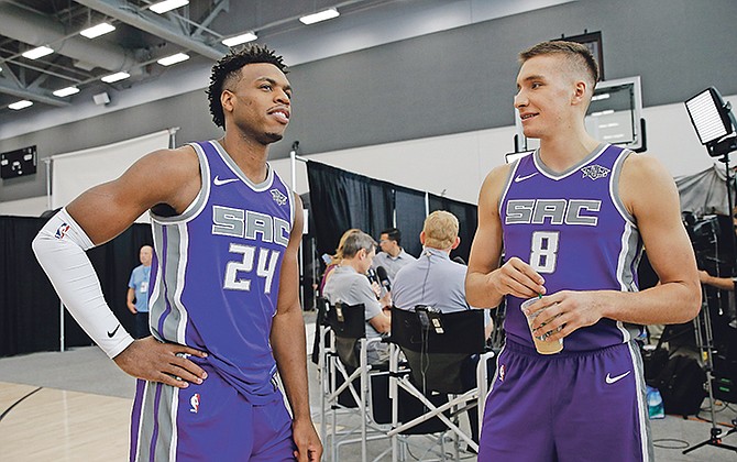 Sacramento Kings’ Buddy Hield, left, and Bogdan Bogdanovic talk during the NBA team’s media day on Monday in Sacramento, California.

(AP Photo/Rich Pedroncelli)

 