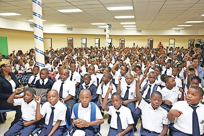 STUDENTS at Stephen DIllet Primary School yesterday after it reopened following lengthy renovations. Photos: Terrel W. Carey/Tribune Staff
