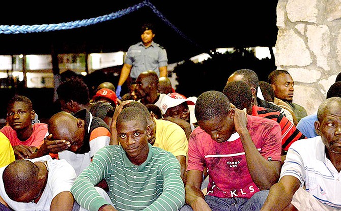 A group of Haitian migrants at HMBS Coral Harbour after they were apprehended in Bahamian waters on Friday 
(RBDF Photo by Leading Mechanic Al Rahming)