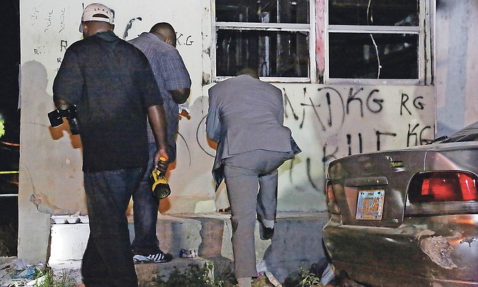 POLICE at the scene of the shooting off Wulff Road on Tuesday night.  
Photo: Terrel W Carey/Tribune staff