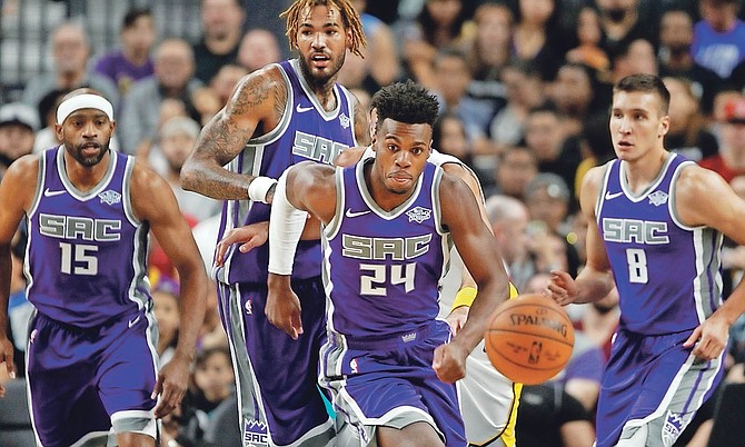 Kings guard Buddy Hield (24) eyes a loose ball with teammates during Sunday’s preseason game at the T-Mobile Arena in Las Vegas. (AP)
