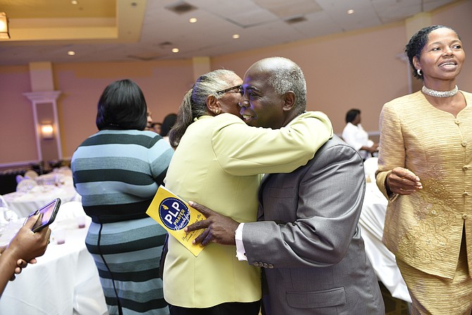 PLP leadership candidate Philip ‘Brave’ Davis is greeted by a supporter at a prayer breakfast at the weekend. 
Photo: Shawn Hanna/Tribune staff