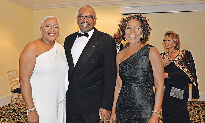 DR Minnis is pictured with Mrs Minnis, right, and President of the Senate Katherine Forbes-Smith. In the background at far right is Grand Bahama Port Authority Vice-Chairman Sarah St George. Photo: Yontalay Bowe/OPM Media Services