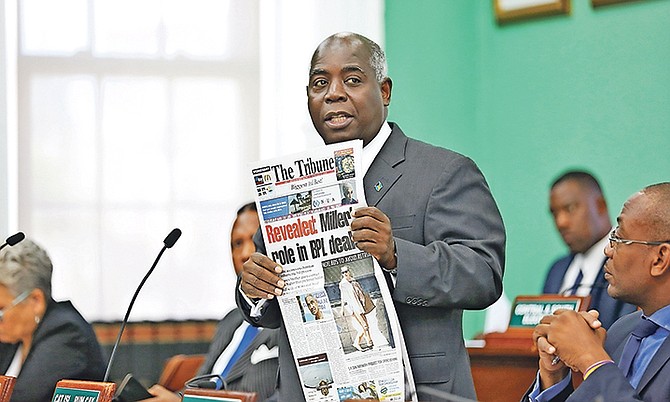 Leader of the Opposition Philip ‘Brave’ Davis MP holding a copy of yesterday’s Tribune in the House of Assembly. Photo: Terrel W. Carey/Tribune Staff