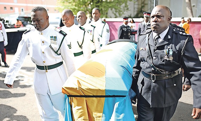 The coffin of Sir Arlington Butler is carried outside Christ Church Cathedral. Photo: Terrel W. Carey/Tribune Staff