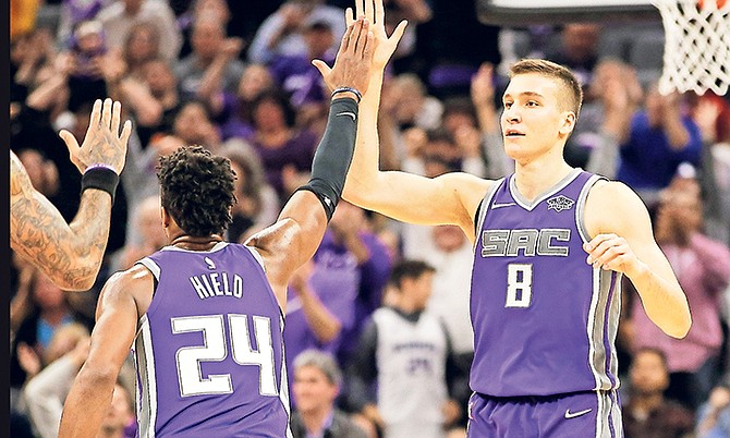 Sacramento Kings’ Buddy Hield, left, and Bogdan Bogdanovic exchange high fives in the closing moments of the Kings 113-102 win over the Los Angeles Lakers on Wednesday night.

(AP Photo/Rich Pedroncelli)

 