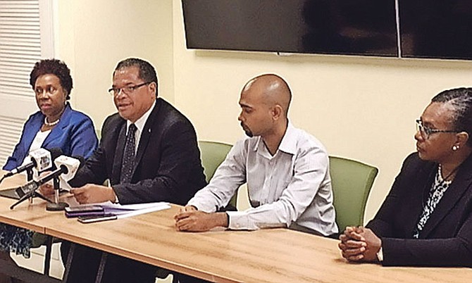 Minister of Labour Senator Dion Foulkes launches the Citizen Security and Justice Programme on Monday. From left, Cecelia Strachan, permanent secretary in the Ministry of Labour; Senator Foulkes; Chet Pratt, IDB project consultant; Althea Albury, acting director of labour in the Department of Labour. Photo: BIS

 

 