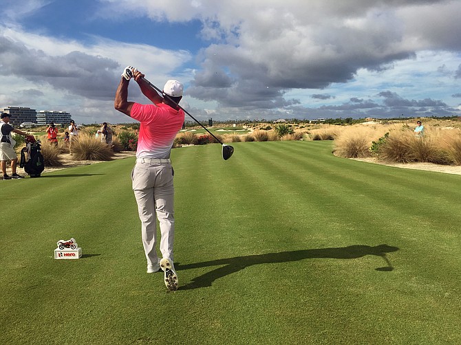 Tiger Woods tries to drive the 7th green during the pro-am for the Hero World Challenge at Albany Golf Club in Nassau, Bahamas on Wednesday. Woods is playing for the first time since back surgery in April. (AP Photo/Doug Ferguson)
