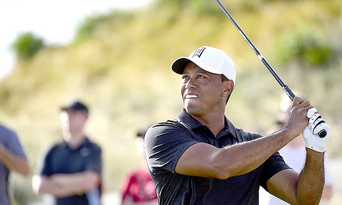 Tiger Woods tees off from hole 16 during the Hero World Challenge golf tournament at Albany Golf Club in Nassau, Bahamas, Thursday, Nov. 30, 2017. (AP Photo/Dante Carrer)

