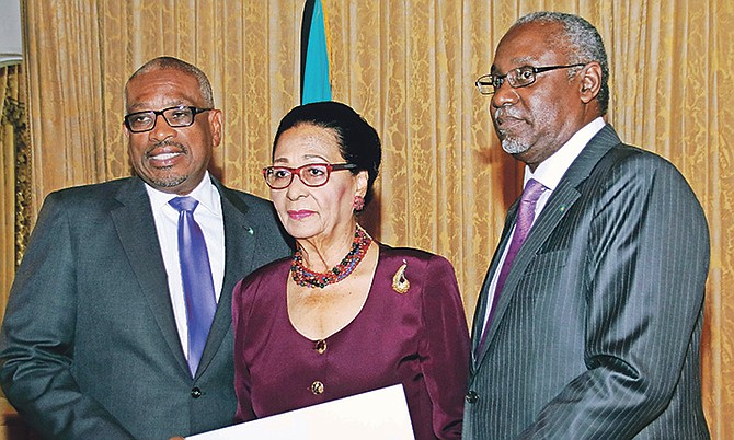 Sir Hartman Longley was sworn in as president of the Court of Appeal by Governor General Dame Marguerite Pindling at Government House on Friday, December 22. Prime Minister Dr Hubert Minnis is also pictured as Sir Hartman received his instrument of appointment. Photos: Derek Smith/BIS.
